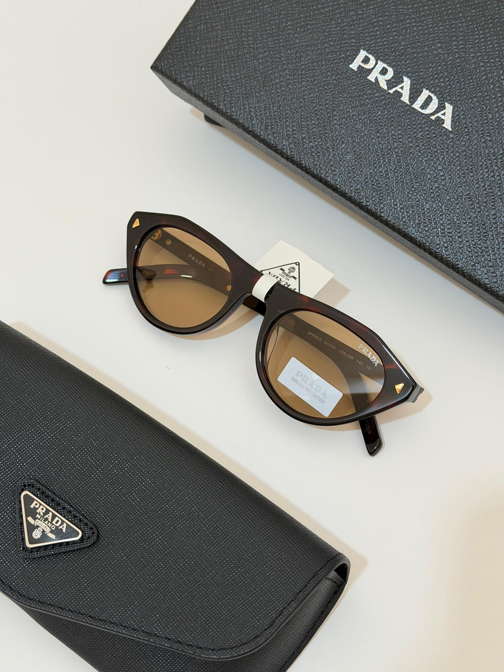 Prada Iconic metal plaque sunglasses